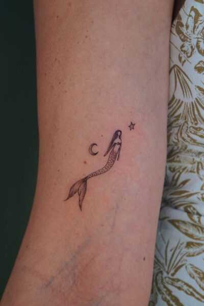 Simple mermaid tattoos with deep meaning and timeless beauty | figtreetattoostudio
