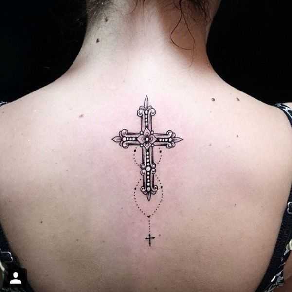 Biblical tattoo featuring the cross
