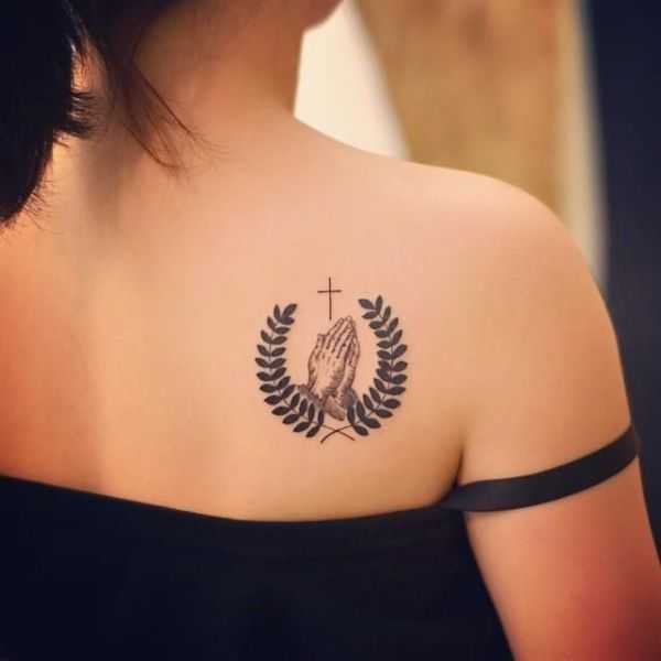 Biblical tattoo of devotion with cross & wreath