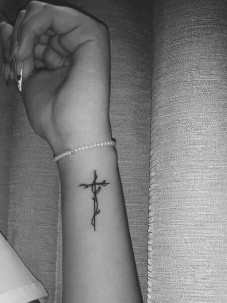 A Timeless Cross Tattoo That Grows with Your Story