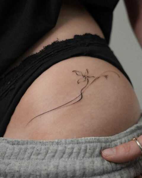 Minimalist and Fine-Line Hip Tattoo
